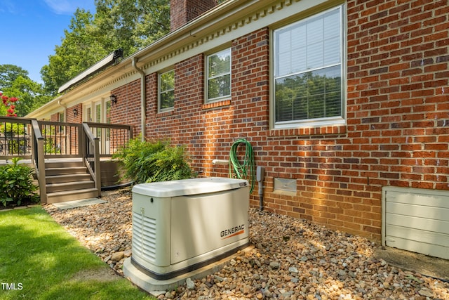4009 Pepperton Dr, Raleigh, NC 27606 - view of side of property with a deck, brick siding, and a chimney