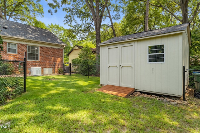 4009 Pepperton Dr, Raleigh, NC 27606 - fenced backyard featuring a storage shed