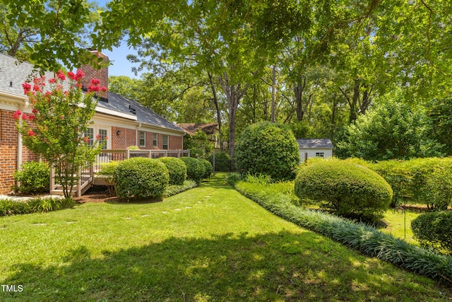 4009 Pepperton Dr, Raleigh, NC 27606 - view of green lawn featuring a deck