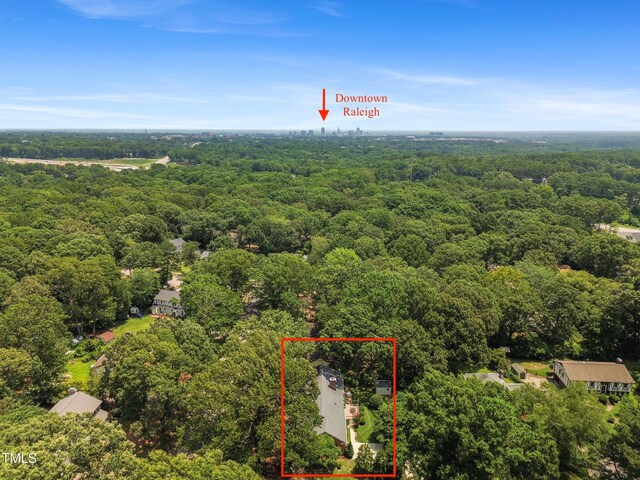 4009 Pepperton Dr, Raleigh, NC 27606 - aerial view of property and surrounding area with a heavily wooded area and property boundaries highlighted