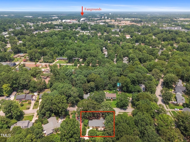 4009 Pepperton Dr, Raleigh, NC 27606 - aerial view of property and surrounding area with property parcel outlined and a heavily wooded area