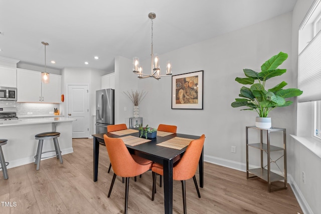 1315 Canary Pepper Dr Unit 28, Durham, NC 27713 - dining area with light wood finished floors, a chandelier, recessed lighting, and plenty of natural light