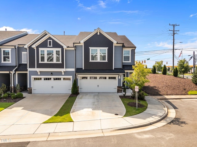 1315 Canary Pepper Dr Unit 28, Durham, NC 27713 - view of front facade with driveway, a garage, and stone siding