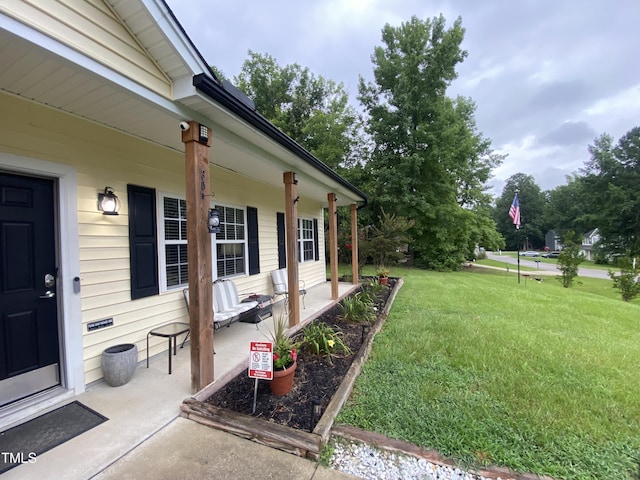 30 Bethany Ln, Youngsville, NC 27596 - view of green lawn with a porch