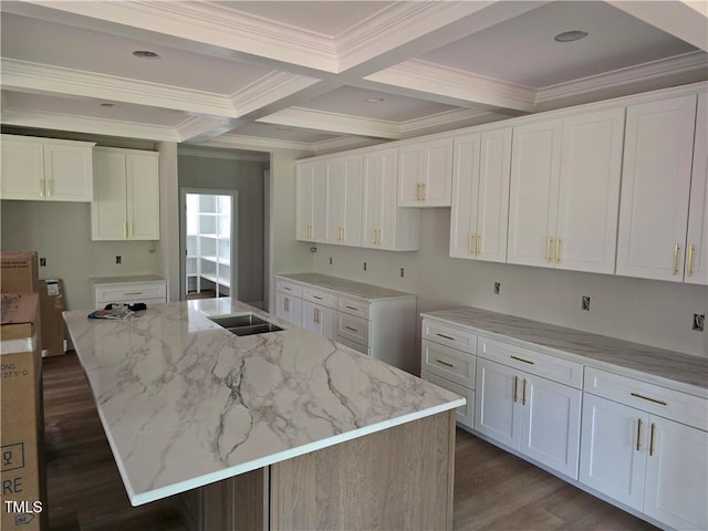 3501 Wesley Point Dr, Browns Summit, NC 27214 - kitchen with beam ceiling, crown molding, dark wood-type flooring, light stone countertops, and white cabinetry