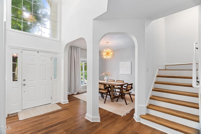 2800 Becketts Ridge Dr, Hillsborough, NC 27278 - entryway featuring dark wood-type flooring, stairway, arched walkways, and a high ceiling