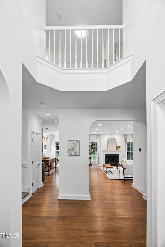 2800 Becketts Ridge Dr, Hillsborough, NC 27278 - foyer entrance featuring arched walkways, wood finished floors, a fireplace, healthy amount of natural light, and a high ceiling