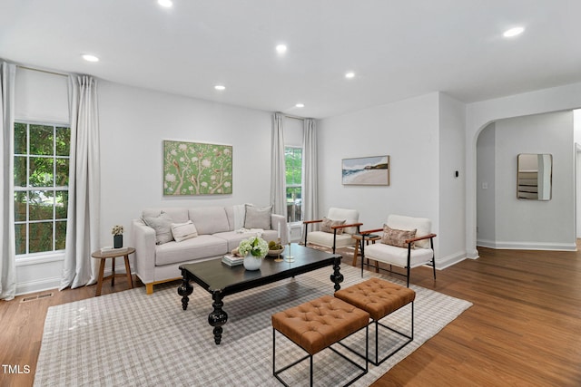 2800 Becketts Ridge Dr, Hillsborough, NC 27278 - living room with arched walkways, wood finished floors, and recessed lighting
