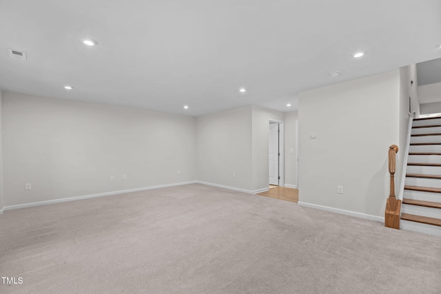 1119 Platform Dr, Apex, NC 27502 - below grade area featuring light carpet, recessed lighting, and stairway