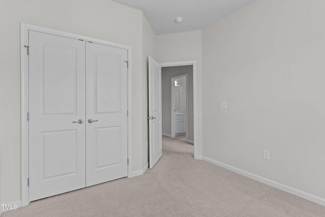 1119 Platform Dr, Apex, NC 27502 - unfurnished bedroom featuring light carpet and a closet