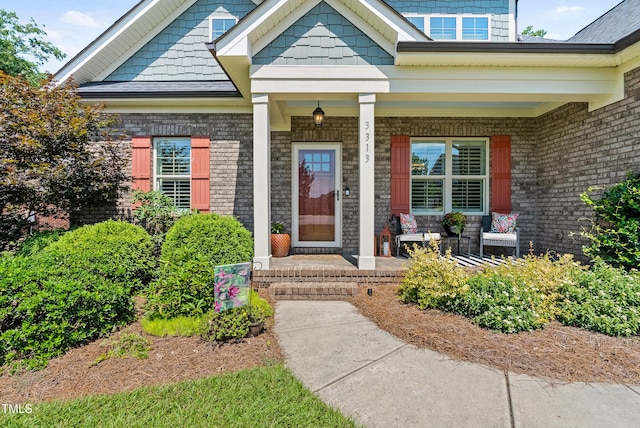3313 Bentwinds Bluffs Ln, Fuquay Varina, NC 27526 - property entrance featuring covered porch and brick siding