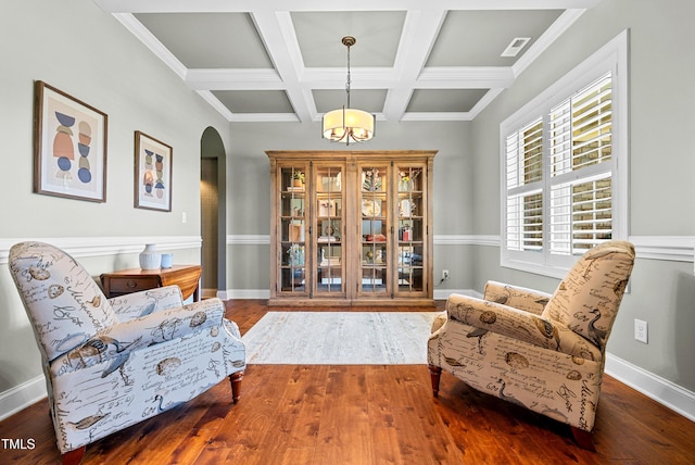 3313 Bentwinds Bluffs Ln, Fuquay Varina, NC 27526 - sitting room with arched walkways, wood finished floors, coffered ceiling, and beam ceiling