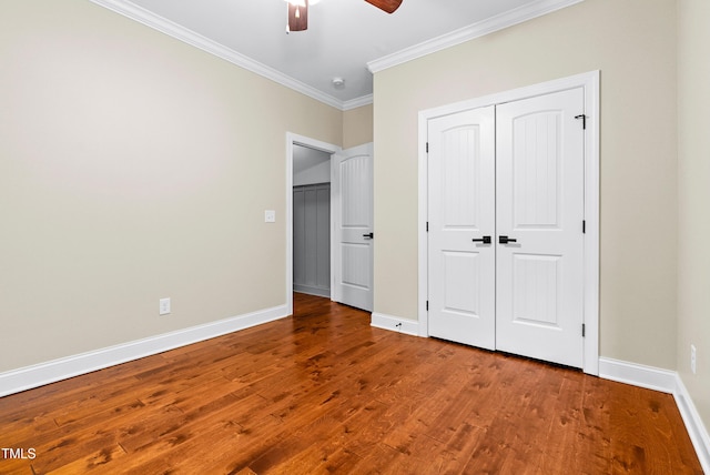 3313 Bentwinds Bluffs Ln, Fuquay Varina, NC 27526 - unfurnished bedroom featuring ornamental molding, wood finished floors, a closet, and ceiling fan