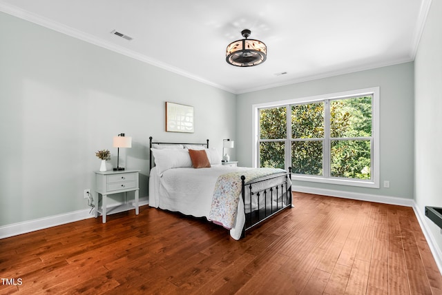 3313 Bentwinds Bluffs Ln, Fuquay Varina, NC 27526 - bedroom with dark wood finished floors and ornamental molding