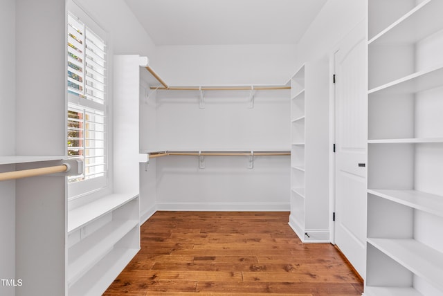 3313 Bentwinds Bluffs Ln, Fuquay Varina, NC 27526 - walk in closet featuring wood finished floors