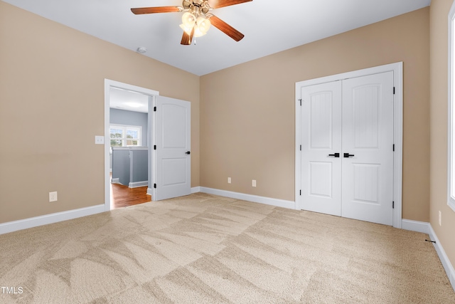 3313 Bentwinds Bluffs Ln, Fuquay Varina, NC 27526 - unfurnished bedroom featuring light colored carpet, a closet, and ceiling fan
