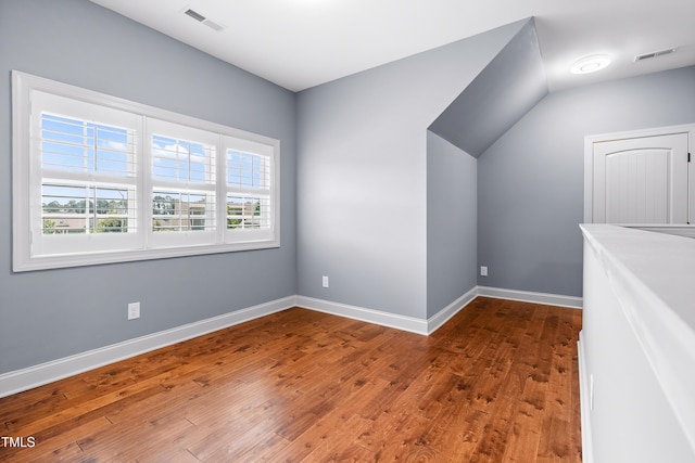 3313 Bentwinds Bluffs Ln, Fuquay Varina, NC 27526 - additional living space featuring wood finished floors and lofted ceiling
