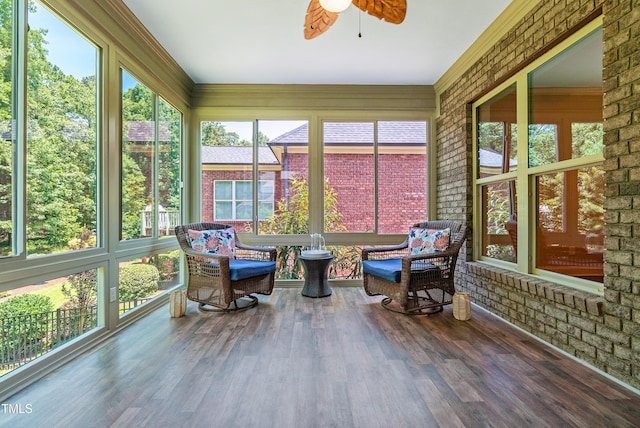 3313 Bentwinds Bluffs Ln, Fuquay Varina, NC 27526 - sunroom featuring a ceiling fan, wood finished floors, and brick wall