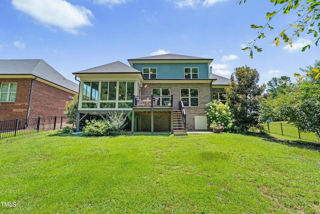 3313 Bentwinds Bluffs Ln, Fuquay Varina, NC 27526 - back of house with stairs, a sunroom, a fenced backyard, and a wooden deck