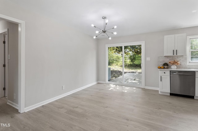 946 Jacksontown Rd, Henderson, NC 27537 - kitchen featuring dishwasher, light wood-style flooring, a chandelier, light countertops, and backsplash