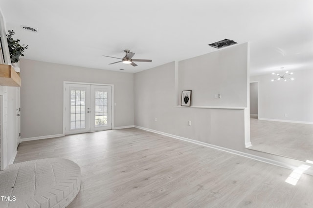 946 Jacksontown Rd, Henderson, NC 27537 - unfurnished living room with a ceiling fan, light wood finished floors, french doors, and a chandelier