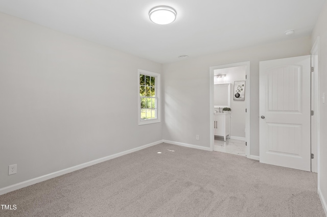 946 Jacksontown Rd, Henderson, NC 27537 - unfurnished bedroom featuring carpet floors and ensuite bathroom