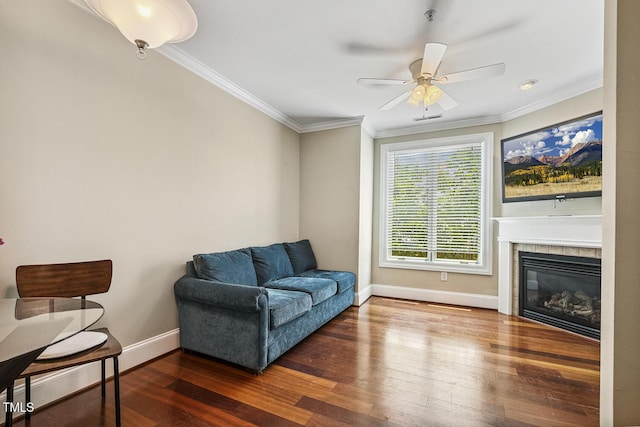 400 W Rosemary St Unit 102, Chapel Hill, NC 27516 - sitting room featuring dark wood-style floors, ornamental molding, a ceiling fan, and a tiled fireplace