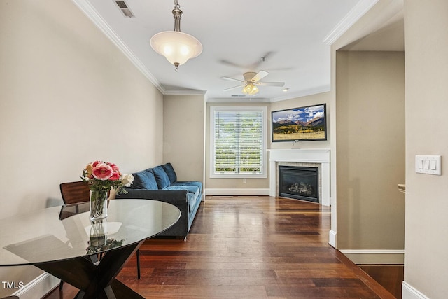 400 W Rosemary St Unit 102, Chapel Hill, NC 27516 - living room featuring crown molding, hardwood / wood-style floors, a glass covered fireplace, and a ceiling fan