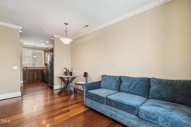 400 W Rosemary St Unit 102, Chapel Hill, NC 27516 - living room featuring ornamental molding, dark wood finished floors, and recessed lighting