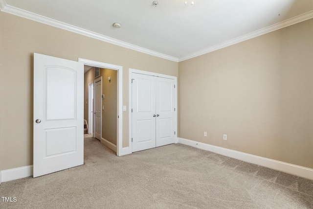 400 W Rosemary St Unit 102, Chapel Hill, NC 27516 - unfurnished bedroom featuring crown molding, light colored carpet, and a closet
