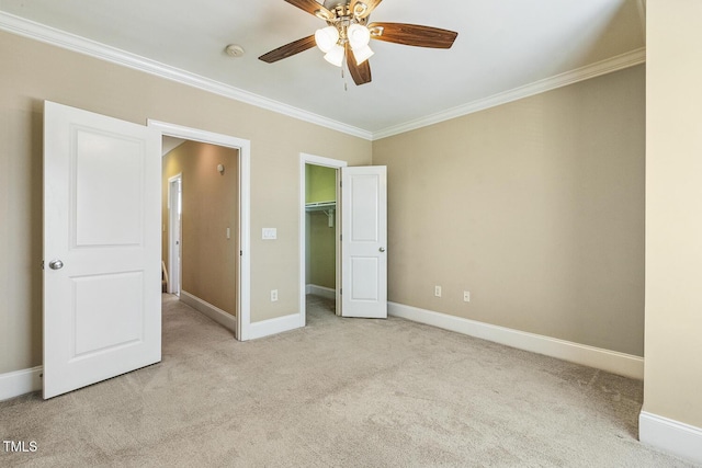 400 W Rosemary St Unit 102, Chapel Hill, NC 27516 - unfurnished bedroom with carpet flooring, crown molding, a walk in closet, ceiling fan, and a closet