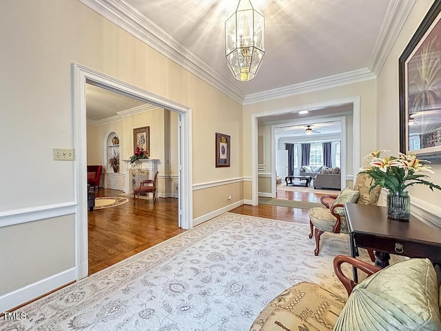 141 Country Club Dr, Henderson, NC 27536 - hallway with ornamental molding, a chandelier, and wood finished floors