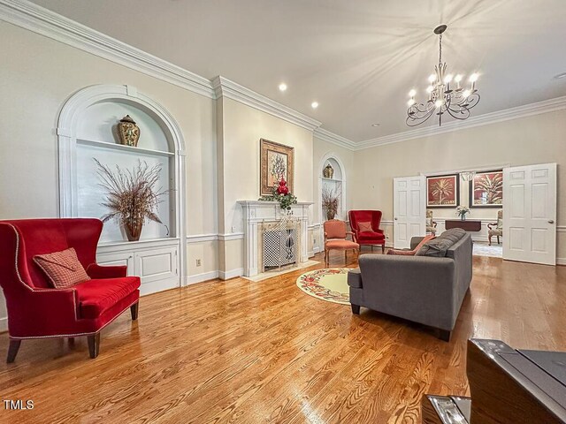 141 Country Club Dr, Henderson, NC 27536 - living room with a chandelier, crown molding, wood finished floors, and recessed lighting