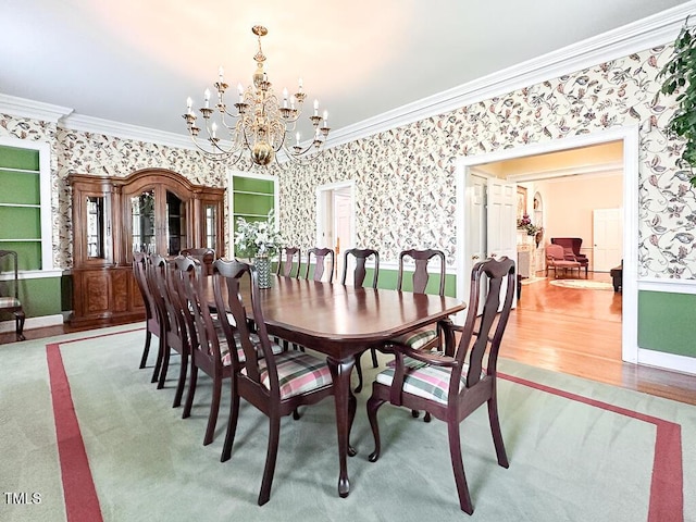 141 Country Club Dr, Henderson, NC 27536 - dining area featuring wallpapered walls, crown molding, a chandelier, and wood finished floors