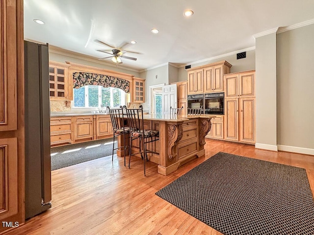 141 Country Club Dr, Henderson, NC 27536 - kitchen featuring freestanding refrigerator, crown molding, a breakfast bar area, ceiling fan, and oven