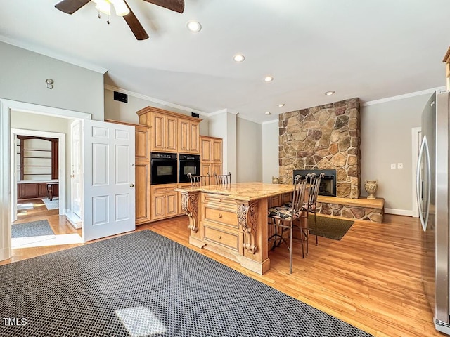 141 Country Club Dr, Henderson, NC 27536 - kitchen featuring freestanding refrigerator, crown molding, oven, light wood-style flooring, and a ceiling fan
