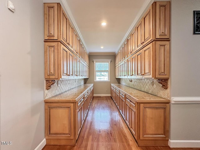 141 Country Club Dr, Henderson, NC 27536 - bar with light wood finished floors, backsplash, crown molding, and recessed lighting