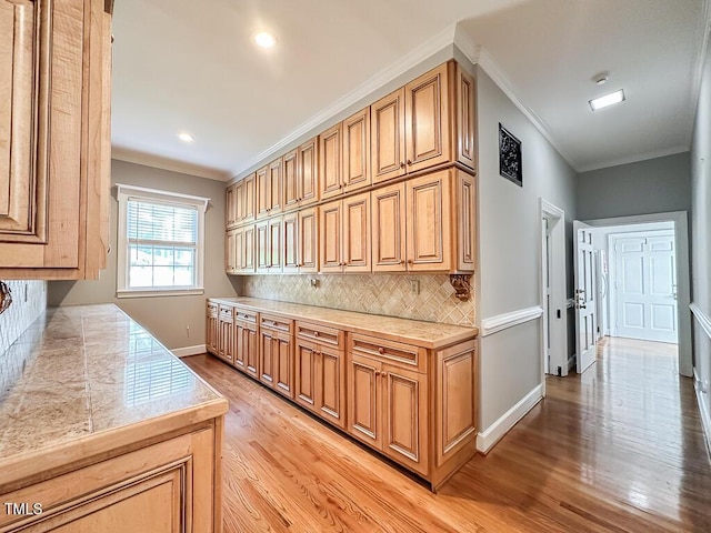 141 Country Club Dr, Henderson, NC 27536 - kitchen featuring tasteful backsplash, light wood-type flooring, ornamental molding, and recessed lighting