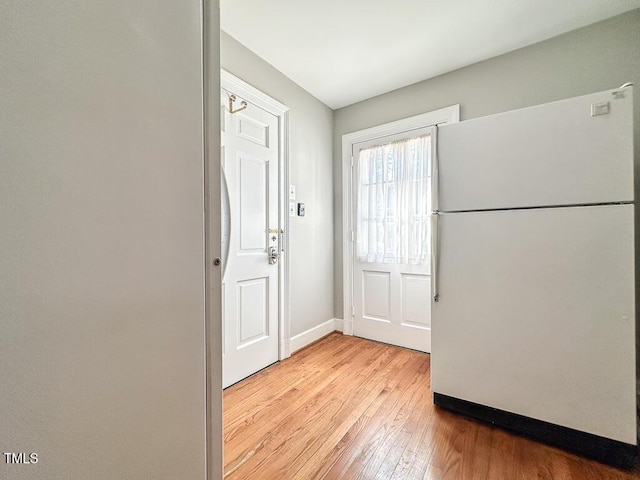 141 Country Club Dr, Henderson, NC 27536 - doorway featuring light wood-style flooring and baseboards