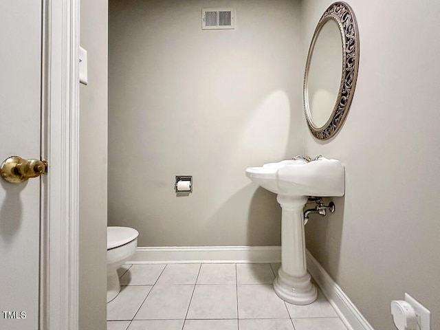 141 Country Club Dr, Henderson, NC 27536 - half bathroom with toilet and tile patterned flooring