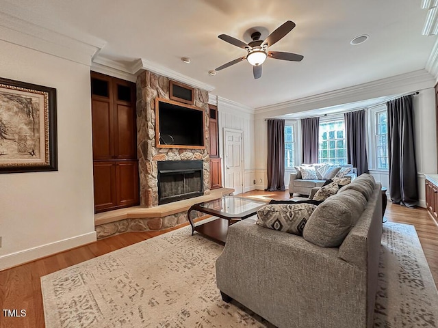 141 Country Club Dr, Henderson, NC 27536 - living area featuring crown molding, a ceiling fan, a stone fireplace, and wood finished floors