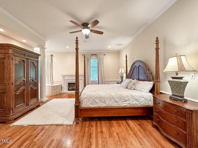 141 Country Club Dr, Henderson, NC 27536 - bedroom featuring light wood-style floors, recessed lighting, crown molding, decorative columns, and ceiling fan