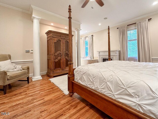 141 Country Club Dr, Henderson, NC 27536 - bedroom featuring light wood finished floors, multiple windows, ornate columns, crown molding, and recessed lighting