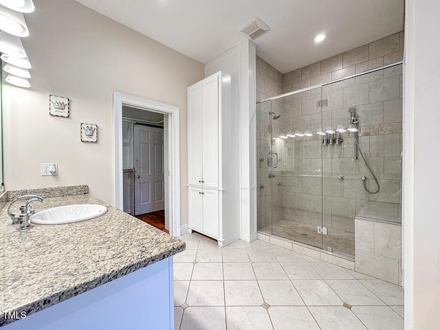 141 Country Club Dr, Henderson, NC 27536 - full bathroom with vanity, a stall shower, tile patterned flooring, and recessed lighting