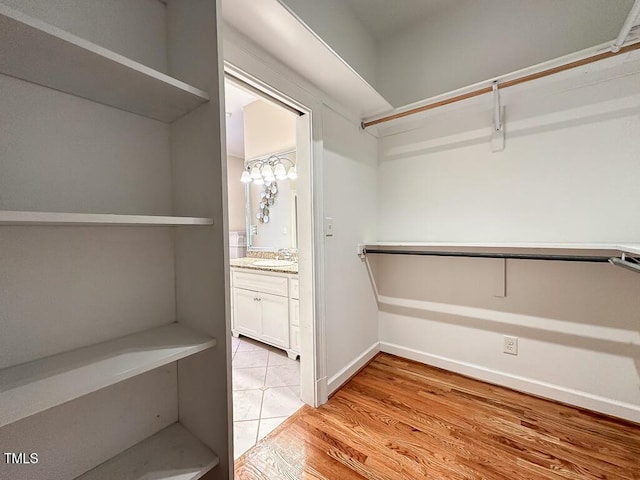 141 Country Club Dr, Henderson, NC 27536 - spacious closet with a sink and light wood-type flooring
