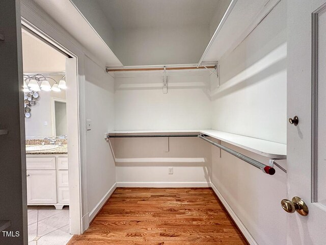 141 Country Club Dr, Henderson, NC 27536 - spacious closet with a sink and light wood-style flooring