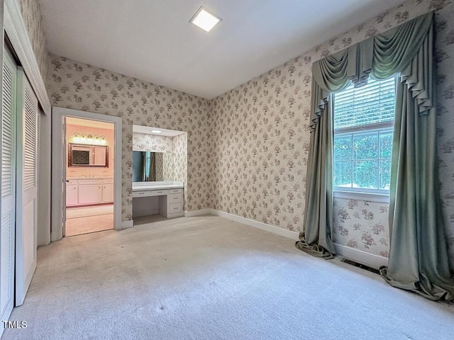 141 Country Club Dr, Henderson, NC 27536 - unfurnished living room with wallpapered walls and carpet floors