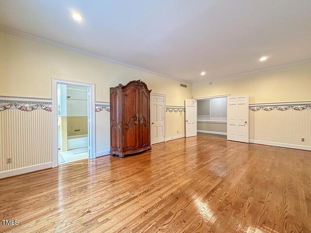141 Country Club Dr, Henderson, NC 27536 - empty room featuring wood finished floors, crown molding, wainscoting, and recessed lighting