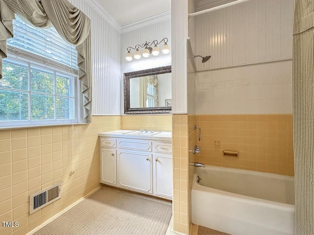 141 Country Club Dr, Henderson, NC 27536 - bathroom featuring tile walls, crown molding, shower / washtub combination, vanity, and tile patterned floors