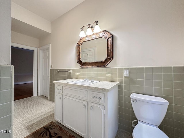 141 Country Club Dr, Henderson, NC 27536 - bathroom with vanity, tile walls, a wainscoted wall, and tile patterned floors